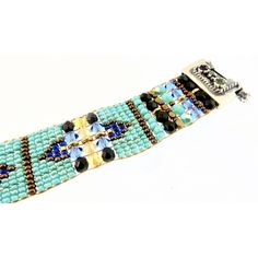 CHILI ROSE Blue Desert Cowboy Gemstone Bracelet Adonnah Langer hand looms Czech and Japanese seed beads with Czech fire-polished and brass beads woven into spectacular intricate designs Gorgeous Southwest pattern with stunning combination of Blue, Turquoise , Jet and a hint of Cornflower Perfect accent for Jeans & Tee! The end caps and clasp are all set sterling silver .925 with gemstones of Garnet-Citrine-Blue Topaz (All of which may be customized) -Bracelet measures as shown 6 3/4 inch end to Blue Artisan Handwoven Jewelry, Artisan Handwoven Blue Jewelry, Traditional Blue Handwoven Beaded Bracelets, Artisan Blue Bracelets With Spacer Beads, Artisan Blue Beaded Bracelets, Blue Handwoven Bracelet, Traditional Blue Bracelets With Spacer Beads, Artisan Blue Handwoven Beaded Bracelets, Artisan Adjustable Beaded Gems And Cabochons