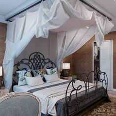 the canopy bed is made up with white drapes on it's headboard