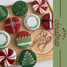 decorated christmas cookies on a wooden tray