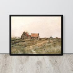 an old house in the middle of a field with grass and trees around it, framed on