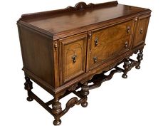 an old fashioned wooden cabinet with drawers and wheels on it's legs, against a white background