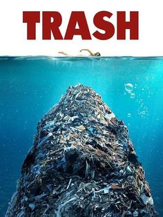 trash floating on top of the ocean next to a man swimming in it's stomach