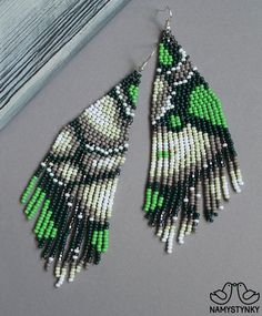 These abstract green beaded earrings are made of high-quality Czech beads and strong synthetic thread. They are elegant, fashionable, and highly versatile, suitable for everyday wear. Features: Sterling silver components Color: Black, gray, white, green, silver. This item is currently in stock. More beaded earrings http://etsy.me/2ycItdb Gerdan necklaces http://etsy.me/2mihf0J Beaded necklaces http://etsy.me/2Dkf1Fo Crochet necklaces http://etsy.me/2CAPdFc Back to shop https://www.etsy.com/shop/ Mmiw Earrings, Turquoise Bead Earrings, Bead Stitch, Fringe Earring, Jewelry Sets Handmade, Beadwork Earrings, Native American Beaded Earrings, Earrings Chandelier, Beads Pictures