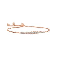 Graduated round diamonds sparkle along this elegant 14k rose gold bracelet. They are held in a sophisticated bezel setting. This bolo bracelet is adjustable to fit most wrists. 14k Rose Gold Bracelet, Solid Gold Bracelet, Bolo Bracelet, April Birthstone Jewelry, Bezel Set Diamond, Unique Bracelets, Yellow Gold Bracelet, Diamond Bracelets, Adjustable Bracelet