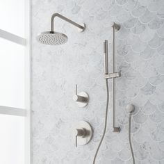 the shower head and handset are shown in this bathroom