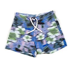 This is a pair of vintage floral motion blur swim trunks, they are in deadstock condition and labeled as a size 30 waist. Blue Hawaiian Style Bottoms For Summer, Blue Hawaiian Summer Bottoms, Hawaiian Style Blue Bottoms For Summer, Blue Swim Trunks For Summer, Hawaiian Style Blue Summer Bottoms, Blue Tropical Swim Trunks, Blue Hawaiian Swim Shorts, Blue Hawaiian Swimming Shorts, Tropical Swimming Shorts For Spring