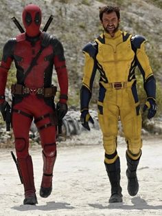 two men in deadpool costumes are walking together