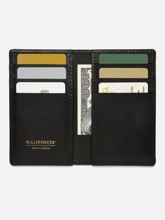 MADE IN U.S.A.: The Vertical Card Wallet features six card slots for carrying your credit cards and ID's. It also features two open inside pockets perfect for storing cash, cards, and more. - Premium bullhide leather- Stitched and hand-painted edges- Stamped with our KILLSPENCER logo in gold foil 3.2" X 5.2" X.7" WEIGHT: Approximately .1 lbs cove Black Bifold Card Holder, Black Bifold Wallet With Interior Card Slots, Black Trifold Card Holder With Interior Slots, Classic Black Trifold Wallet For Everyday Carry, Classic Black Trifold Wallet With Card Slots, Black Bifold Card Holder For Everyday Carry, Classic Black Trifold Wallet For Everyday, Classic Black Trifold Wallet For Daily Use, Black Bifold Card Holder With Phone Sleeve