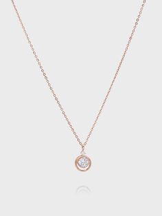 Editor's Notesdmoment presents sophisticated accessories with trendy designs that exude a feminine vibe. - Circular frame- Made of 14K rose gold- Cubic embellished in the middle- Smooth and glossy surface- Sophisticated and feminine mood Measurements (in.)One Size- Chain: 15.75 in. (L)- Pendant: 0.28 in. (W) * 0.31 in. (H) Composition & Care- Material: 14K Rose Gold, Cubic- Plated products may discolor over time due to their nature.- Please be careful that discolorat Luxury Rose Gold Jewelry With Timeless Design, Timeless Rose Gold Jewelry For Evening, Elegant Pink Gold Cubic Zirconia Necklaces, Chic Rose Gold Diamond Jewelry, Elegant Rose Gold Necklaces With Halo Design, Elegant Rose Gold Jewelry With Shiny Finish, Elegant Rose Gold Jewelry With Timeless Design, Elegant Pink Gold Diamond Necklace, Rose Gold Jewelry With Diamond Accents For Evening