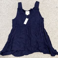 Anthropologie Maeve Tank Color- Navy (The First Photo Is Most Accurate) Size - Small Condition- Nwt, Never Worn Asymmetrical Boots Hem, Flowy Fit, Ruffle Details 100% Rayon Navy Tank Top For Spring, Navy Sleeveless Top For Vacation, Navy Sleeveless Top For Day Out, Velvet Sweatshirt, Boho Tunic Tops, Embellished Sweaters, Dolman Sleeve Tops, Boho Tunics, Anthropologie Top