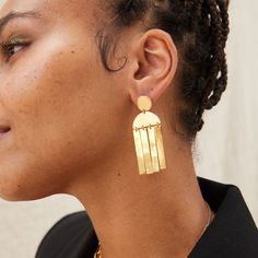 A playful yet sophisticated pair inspired by material and movement, the Maxi Cala Earrings feature a distinctive drop silhouette with a fringe effect. This is an effortless, dangle earring you'll love to wear everywhere and anywhere. Handcrafted in brass by artisans in Kenya using traditional techniques. Handcrafted in brass by artisans in Kenya. Gold products are 24k gold plated brass and match our brass style in color and tone. Your purchase promotes artisan innovation + entrepreneurship. To l Wood Hoop Earrings, Innovation And Entrepreneurship, Hammered Hoop Earrings, Long Dangle Earrings, Threader Earrings, Traditional Techniques, Kenya, Beautiful Earrings, Statement Earrings