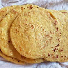 some tortillas are stacked on top of each other