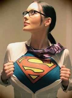 a woman with glasses and a superman shirt