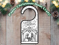 a paper christmas door hanger with a nativity scene