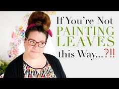 a woman wearing glasses and a black shirt with the words if you're not painting leaves, this way