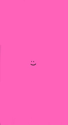 a pink square with a smiley face drawn on it