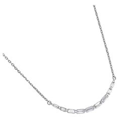 Indulge in the timeless elegance of this breathtaking pendant necklace, featuring a single line of horizontal-set baguette diamonds that create a striking curved bar design. Set in luxurious 18 KT white gold, this stunning piece showcases a total of 0.25 carats of sparkling diamonds, perfectly arranged to catch the light from every angle. The sleek, modern silhouette of the bar pendant adds a touch of contemporary sophistication, making it the perfect accessory to elevate both everyday looks and Belgian Modern, Curved Bar Design, Art Deco Pendant Necklace, Baguette Necklace, Art Nouveau Pendant, Heart Shaped Pendant Necklace, Curved Bar, Bar Pendant Necklace, Gold Bar Necklace