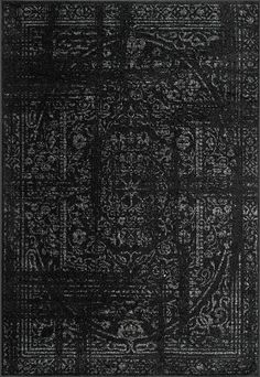 a black rug with an intricate design on it