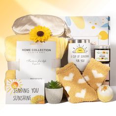 the sun shines gift hamper is filled with goodies, candles and other items