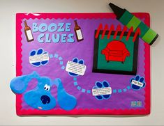 a bulletin board that has been decorated to look like a dog with blue paws and feet