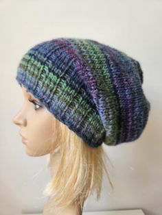 Original, slouchy hand knitted hat.  Handmade of soft muliticolored  yarn: wool and acrylic yarn 53/47%.  Very comfortable, size: stretchy, best for 54-58 cm (21-22 inch) head. The exact position of color stripes may vary a bit, as it is made of multicolor yarn. The waiting time is 1-3 days plus delivery time after the purchase. I always try to complete the project as soon as possible, so it may be shorter :-) Soft Knit Yarn Cap, Soft Knit Yarn Caps, Knitted One Size Bonnet, One Size Knitted Bonnet Hat, One Size Knitted Bonnet, One Size Knit Bonnet Cap, One Size Soft Knit Bonnet, Knitted Hat One Size Fits Most, Knitted One-size Hat For Fall