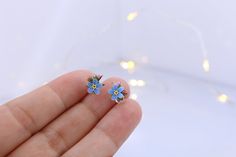 Handmade stud earrings with forget-me-not flowers Made of polymer clay, the flower is not fragile, it has flexible petals. Sold in a gift box. Flower size about 7x7 mm (0.27 inches x 0.27 inches) ❤ flexible petals ❆ not afraid of the cold ☔ not afraid of water All my products you will receive in a gift box! ❀ Please feel free to send me a message if you have any question. Add your valid phone number to the order's note It will be add to the package for better post service Delicate Blue Flower Earrings With Ear Wire, Handmade Blue Whimsical Flower Earrings, Whimsical Blue Flower Earrings For Gift, Whimsical Handmade Blue Flower Earrings, Dainty Blue Earrings For Gifts, Blue Whimsical Earrings For Gifts, Blue Flower-shaped Earrings For Gifts, Light Blue Flower Shaped Jewelry Gift, Light Blue Flower-shaped Jewelry For Gifts