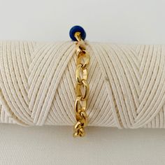 This is two looks in one bracelet. Half of the bracelet is beaded with gold and lapis beads and the other half is a chunky bold gold chain. It measures 18 inches in length and can be adjusted to a smaller size. Please note that the white bracelet shown in some of the photos is not included but can be purchased under Nico-White Gold Beaded Lapis Lazuli Bracelets, Gold Metal Chain Bracelet With Beaded Chain, Gold Metal Chain Bracelet With Beaded Detail, Gold Metal Chain Bracelet With Beads, Blue Adjustable Chain Bracelet For Everyday, Everyday Blue Bracelet With Adjustable Chain, Adjustable Blue Chain Bracelet, White Bracelet, The Other Half