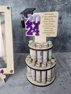 a wooden sign that reads, twenty dollars are stacked on top of each other in front of a mirror