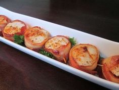 some food is sitting in a white dish on a table