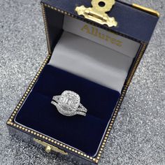 an open box with a ring in it