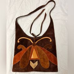 Used Condition, Some Imperfections On Leather From Use. See Pictures. Rare - Vintage Real Suede Leather Hippie Purse From The Late 1960's To Early 1970's Hippie Era. Inside Is Unlined Brown Suede Just Like The Outside. The Outside Has A Butterfly Or Bug Design. There Are 2 Straps, 1 On Each Side, That Hangs Down From The Top Opening. You Could Tie Them Closed But I Think They Are Just For Decoration. No Metal Of Any Kind. Strap Is Long But Is Not Adjustable. This Is The Real Deal. Size: 26.5"' T Vintage Cognac Shoulder Bag For Shopping, Vintage Brown Leather Hobo Bag, Retro Brown Leather Hobo Bag, Vintage Brown Hobo Bag With Leather Backing, Retro Brown Hobo Bag In Tote Shape, Vintage Soft Leather Hobo Bag For Shopping, Vintage Brown Rectangular Hobo Bag, Vintage Shoulder Bag With Leather Backing For Shopping, Vintage Brown Hobo Bag With Leather Handles