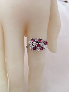 18K White Gold Ruby And Diamond Ring 6 Brilliant Cut AA quality Rubies 1ctw 8 Genuine Diamonds .88ctw SI2 clarity F Color Appraisal $8,000 Beautiful High Diamonds F color grade Rubies AA quality Gorgeous 18K Gold Ring Weighs- 5.2 grams Ring size - 7.25 Visit our shops on Etsy HauteCoutureLaLa TrendsCouture BeautifulPatina LastingTrends Combine shipping within the first three shops listedFree Shipping on orders over $35.00 however if there is a return buyer to refund seller for the free shipping Forever Rings, Ruby And Diamond Ring, Ruby Diamond Rings, Diamonds Ring, 18k Gold Ring, European Cut Diamonds, Ruby Diamond, Pretty Rings, Faceted Gemstones