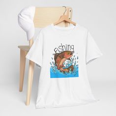 a white t - shirt with an image of a fish on it