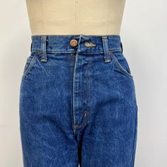 "Vintage 70s high waisted Jantzen jeans featuring; traditional 5 pocket styling a high waist zip fly with single button at the waist straight leg fabric tag with \"Jantzen\" diver logo on the coin pocket, and \"Jantzen\" tab on the back pocket of a heavy, 100% cotton denim in a dark blue wash labeled \"Jantzen Made in USA\" and tagged a size 10, measurements when laid out flat are; 13 1/2 inches at the waist 19 1/2 inches at the hip 13 inch rise 35 1/2 inch inseam in good, preworn, vintage condi Womens Jeans, Fabric Tags, Vintage 70s, Made In Usa, Dark Blue, High Waist, Straight Leg, Women Jeans, Size 10