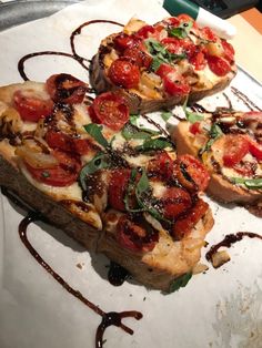 three slices of pizza with toppings sitting on a plate