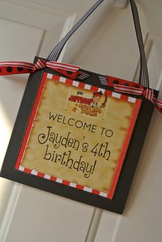 a birthday sign hanging from the front door