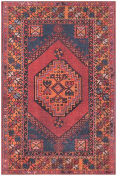 an orange, blue and red rug with geometric designs on the bottom half of it