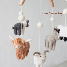 three crocheted animals hanging from a string