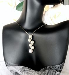 Very unique, this natural pearl necklace adds a classy look that makes an elegant and feminine statement. The pendant is set in 925 sterling silver (marked) and it features excellent quality freshwater pearls surrounded by high grade cubic zirconia in an intricate, eye-catching design. The sterling silver has been rhodium dipped for a bright finish, which perfectly enhances the intricate detailing and makes it tarnish resistant. The pendant is about 1.5" (approx. 3.8cm) long by 0.3" (approx. 0.8 Natural Pearl Necklace, Pearl Jewelry Wedding, Silver Box, Natural Pearl, Pearl Wedding, Elegant Necklaces, Bridal Necklace, How To Look Classy, Natural Pearls