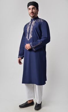 Fabric is 100% cotton Poplin Front button down Mandarin collar Front yoke and sleeves embroidered Length is 42-44" Side Pockets Machine wash cold with like colors and tumble dry Traditional Blue Kurta With Embroidered Sleeves, Eid Long Sleeve Kurta With Embroidered Cuffs, Long Sleeve Kurta With Embroidered Cuffs For Eid, Traditional Long Sleeve Kurta With Embroidered Cuffs, Spring Kurta With Embroidered Cuffs And Long Sleeves, Spring Long Sleeve Kurta With Embroidered Cuffs, Festive Cotton Kurta With Embroidered Cuffs, Cotton Kurta With Embroidered Cuffs Long Sleeve, Cotton Kurta With Embroidered Cuffs