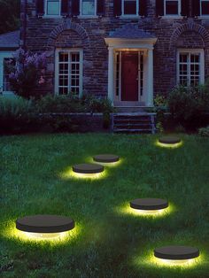 some lights that are on in the grass