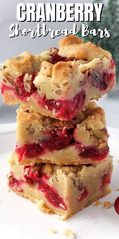 three cranberry shortbread bars stacked on top of each other