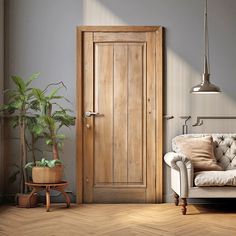 a living room with a white couch and wooden door in the corner next to a potted plant