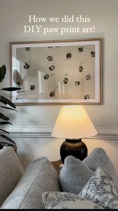 a lamp sitting on top of a table next to a couch