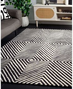 a black and white rug in a living room