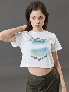 Editor's NotesKOLEAT's cropped ocean beach graphic t-shirt with a soft texture and unique mood of KOLEAT. The t-shirt is comfortable and perfect for classic outfits.- Cropped ocean beach graphic t-shirt - Summer t-shirt with a cropped length- Has a graphic and lettering design of ocean beach- Comfortable t-shirt for versatile styling- Creates a retro moodMeasurements (inch)- Length: 16.5 inch- Shoulder: 14.7 inch- Chest: 18.1 inch- Sleeve length: 6.7 inch* model info: height 5'7 / Casual Crew Neck Crop Top For Beach Season, Cotton Short Sleeve Crop Top For Beach Season, White Crew Neck Cropped Shirt For Summer, Trendy Crew Neck Crop Top For Vacation, Beach Season Cotton Short Sleeve Crop Top, White Crew Neck Crop Top For Beach, Relaxed Fit Short Sleeve Crop Top For Beach, Summer Graphic Print Cropped Shirt, White Graphic Tee Crop Top For Summer