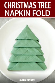 christmas tree napkin fold on a white plate