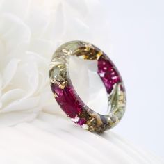 This ring is a symbol of nature with it you will feel a particle of nature near you Materials: Resin, Pressed Purple Flowers, gray tree bark, gray moss. Gold24K Purple color means love, affection, truthfulness, sincerity, power, nobility Custom orders are welcome. Every item comes in a beautiful, individual original box ready for gift giving. Natural VyTvir rings are made with great love for nature If you have any questions please contact me. All rings are resin: https://www.etsy.com/ru/shop/VyTvir?ref=l2-shopheader-name§ion_id=17463694 All rings are made of wood and resin: https://www.etsy.com/ru/shop/VyTvir?section_id=21364732 All rings are made of wood: https://www.etsy.com/ru/shop/VyTvir?section_id=17062884 All rings are made of stainless steel and titanium; https://www.etsy.com/ru/sho Unique Purple Crystal Gift Ring, Purple Color Meaning, Handmade Elegant Resin Rings, Purple Flower Jewelry With Pressed Flowers, Plant Rings, Purple Flower Pendant With Pressed Flowers, Purple Flower-shaped Jewelry With Pressed Flowers, Gray Tree, Green Rings