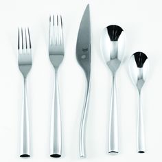 four forks, two spoons and one knife on a white surface