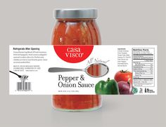 a jar of pepper and onion sauce next to some vegetables on a table with a label for casca visco